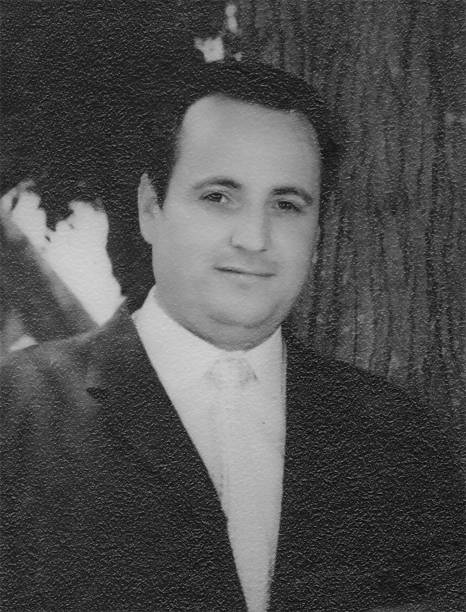 photo taken in late 1950s: retro headshot mid adult man looking at the camera stock photo