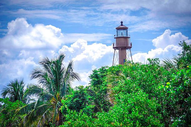 istock Sanibel Island Lighthouse Over Lush Greenery and Blue Sky 2224180871