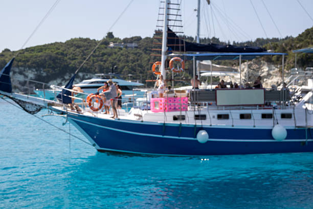 Antipaxos, Greece, jun 21, 2025. blue boat defocused, abstract blur on turquoise water