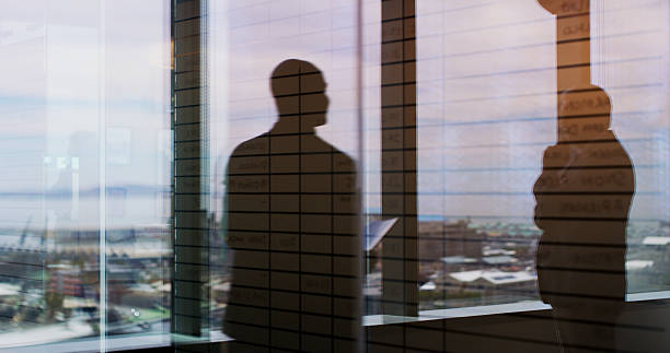 istock Business people, silhouette and window with reflection on balcony for corporate insight or travel. Colleagues, employees or double exposure with vision for negotiation on economic structure in city 2224182480