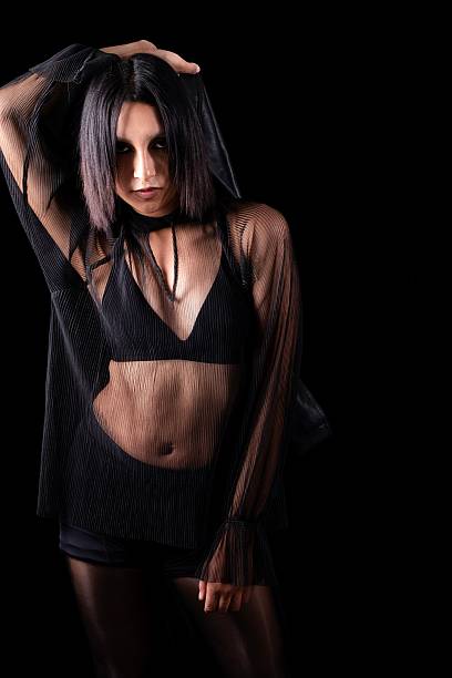 istock person posing in a studio environment with a dark background 2224184159