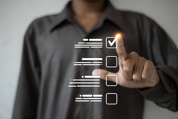 istock A person touches a virtual checklist interface, highlighting a glowing checkmark to represent 2224189151