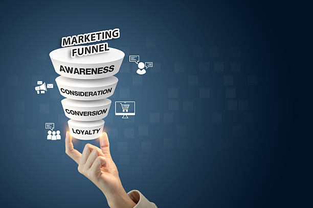 istock Fingertips lifting a glowing marketing funnel with icons representing 2224189894