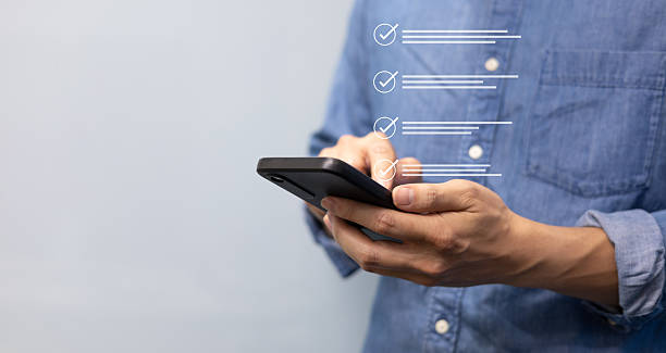 istock close up customer man hand check mark on virtual online questionnaire survey from website to rate score and share satisfy of experience for business corporation concept 2224192110