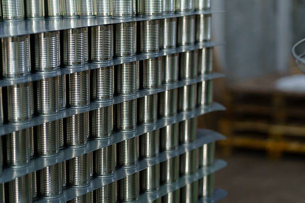 Big group of assorted empty clean preserve tin cans. Close up shot, abstract food industry background.