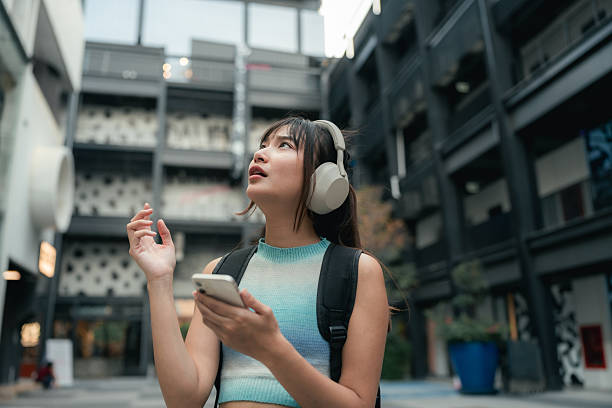 istock Gen Z woman uses a digital map on her smartphone after getting lost 2224199662