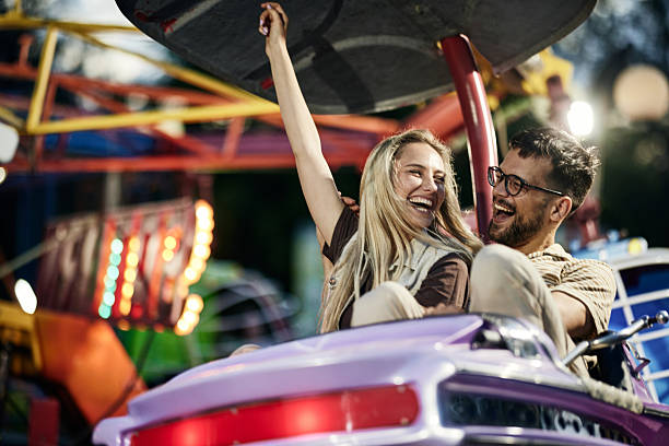 istock Cheerful couple having fun during amusement park ride. 2224204601