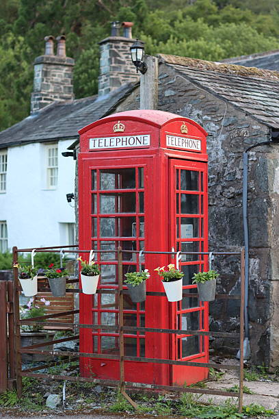 istock Red phone box in an English village 2224204681