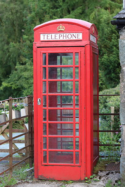 istock Red phone box standing in an English village 2224204701