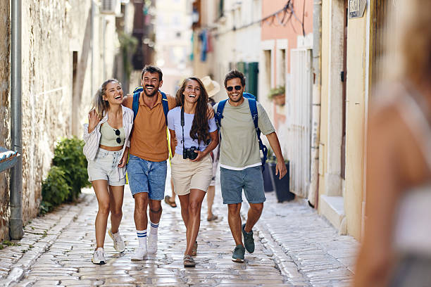 istock Cheerful tourists having fun while walking on the street. 2224205057