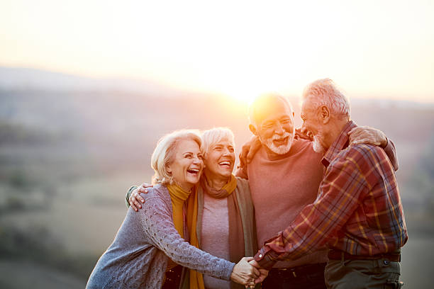 istock Happy embraced friends talking in nature at sunset. 2224205435