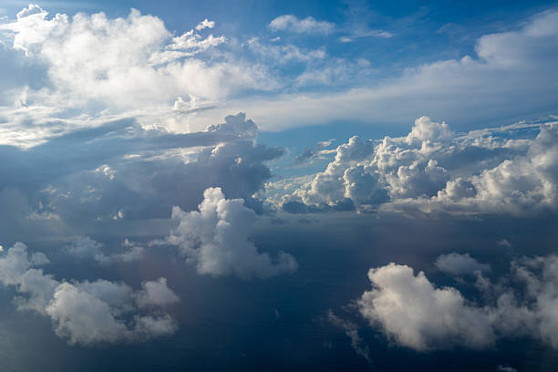 istock Dramatic sky with sunbeams and clouds seen from an airplane 2224205470