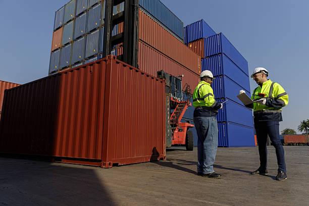 istock Engineers inspect goods and containers for export by global businesses. 2224207405