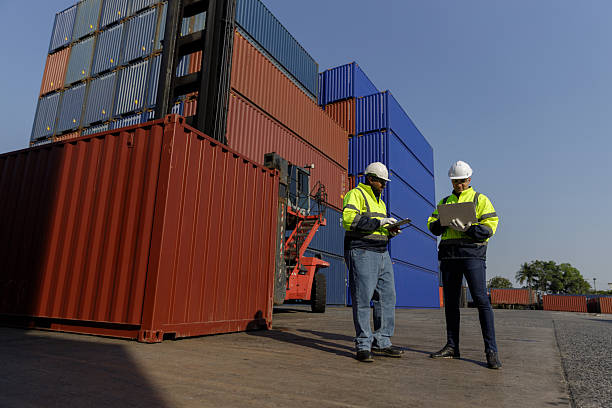 istock Engineers inspect goods and containers for export by global businesses. 2224207408
