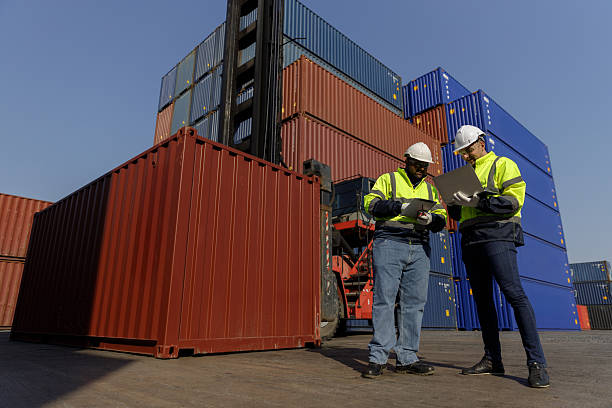 istock Engineers inspect goods and containers for export by global businesses. 2224207440