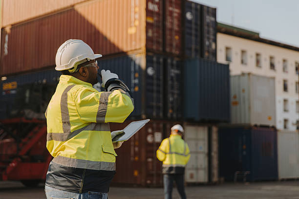 istock Engineers inspect goods and containers for export by global businesses. 2224207550