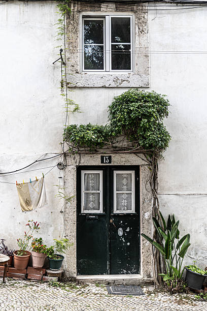 Old wooden door in the neighbourhood of Alfama in Lisbon, Portugal