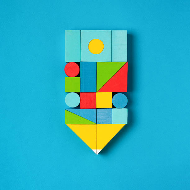 Education concept with pencil made of colorful blocks on blue background. Symbol of learning, creativity, knowledge