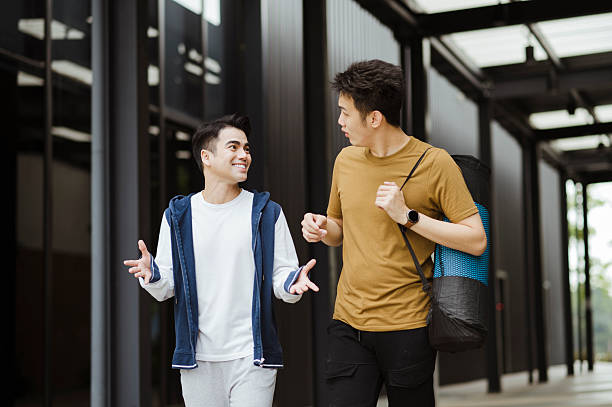 istock Two Asian friends walking to gym. 2224209854