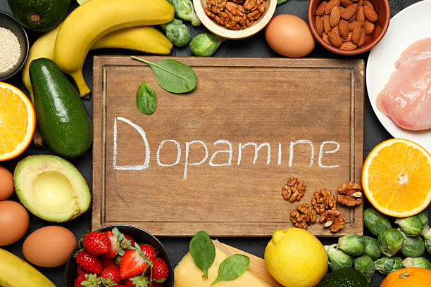 istock Wooden board with word Dopamine and different fresh products on grey table, flat lay 2224210763