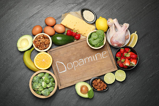 istock Wooden board with word Dopamine and different fresh products on grey textured table, flat lay 2224210855