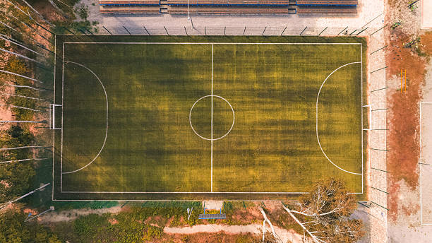 istock aerial stadium view square shape frame pattern sport concept photography from drone with golden colors of autumn season outskirts district area 2224211157