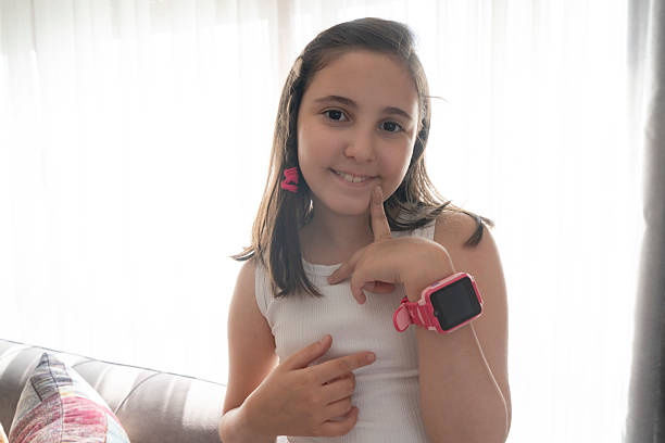 istock Little girl talking on smartwatch 2224218658