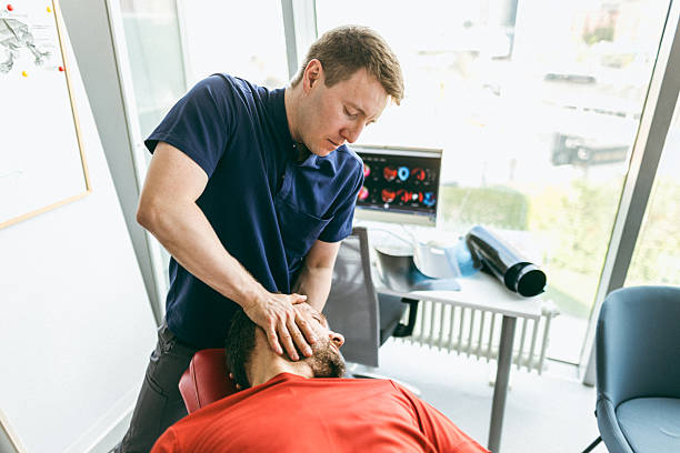 istock Professional chiropractor performing manipulation therapy on a patient in a modern office 2224220181