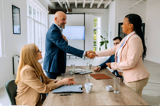 istock Business colleagues shaking hands during office meeting 2224221382