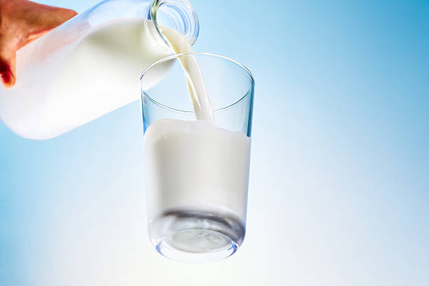 istock Milk being poured into a glass – studio shot with strobe lighting, high resolution 2224222478