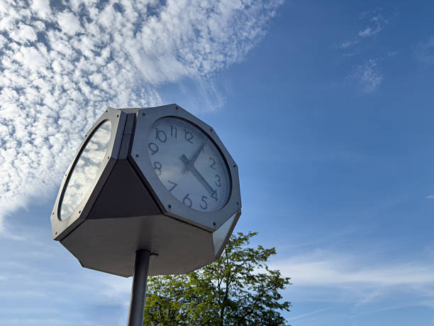 istock Modern outdoor clock mounted on tall metal pole 2224222714