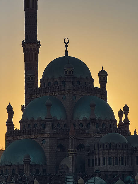 istock El mina masjid mosque glowing at sunset with minaret and domes 2224223603