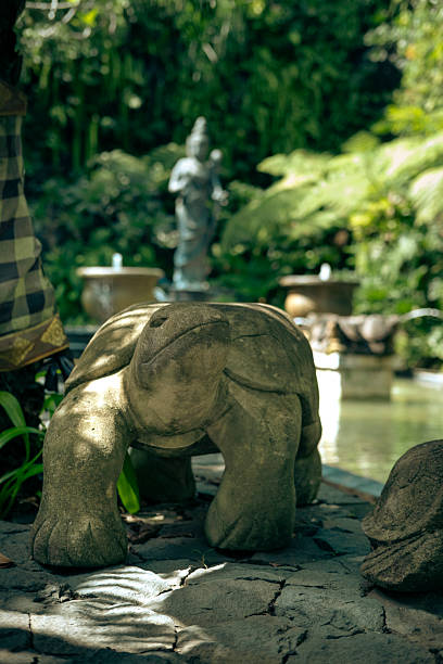 Big tortoise made of stone made in the park.