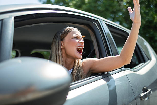 istock Irritated Woman Behind the Wheel During Heavy Traffic 2224225202