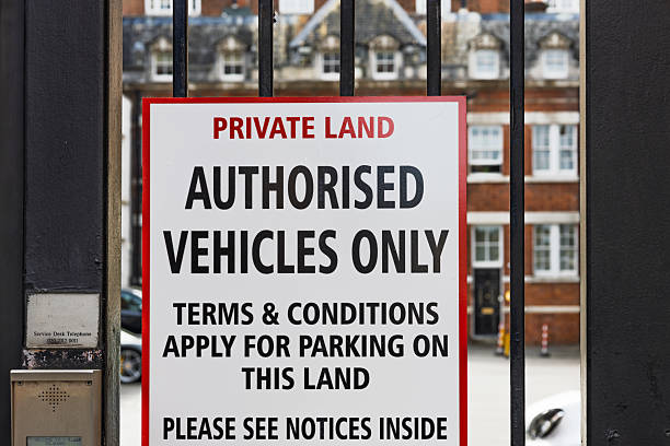 istock Private Land Sign on Black Iron Gate. Authorised Vehicles Only, Parking Terms Apply 2224226905