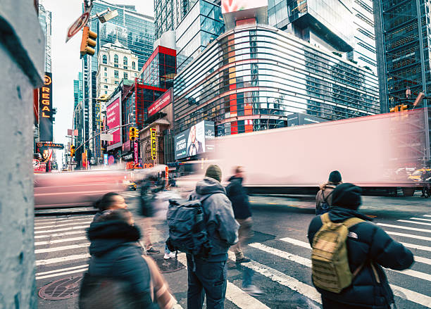 istock motion blurred people crosssing avenue in manhattan 2224227089