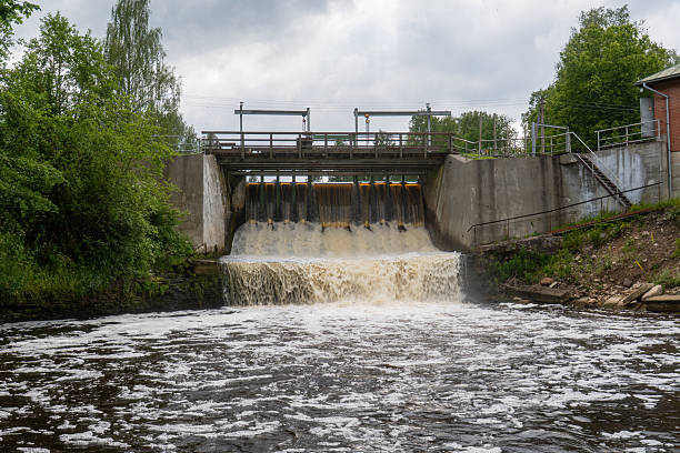 istock Small Hydroelectric Dam Overflow with Foamy River  Waterfall Cascade and Control Gate Infrastructure in Rural Environment. Grbe. Latvia. 08.07.2025 2224228158