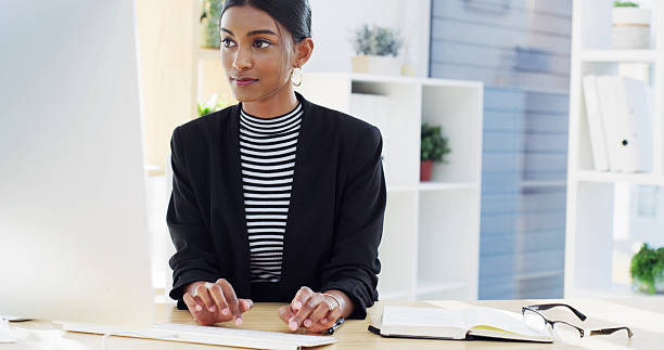 istock Office, businesswoman and notebook with computer for typing, information and reminder for article. Career, female person and copywriter with digital for research, proofreading and angle tips for news 2224231083