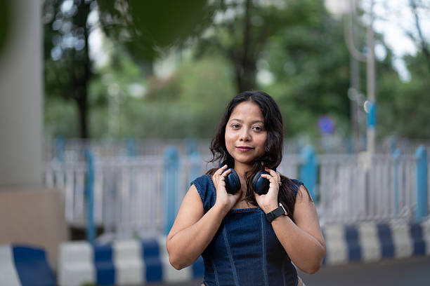 istock Confident Woman Outdoors Enjoying Music 2224232272