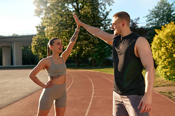 istock Fit couple celebrating after workout with a high five 2224232412