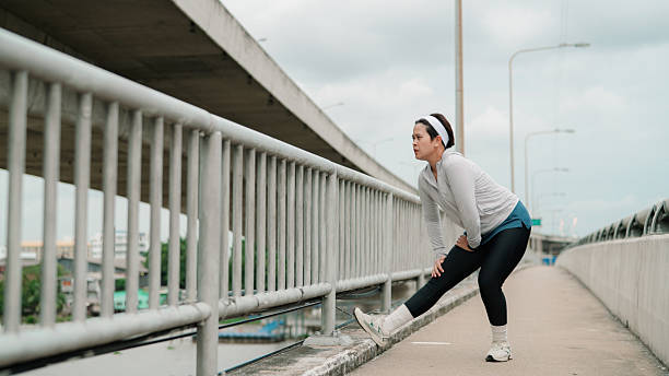 istock Asian woman doing stretching in the city 2224233348