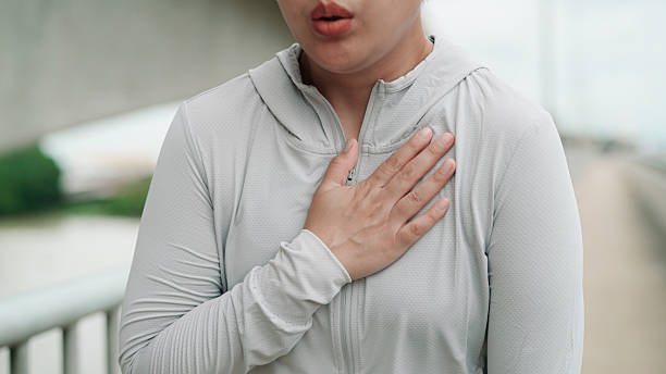 istock Asian woman feeling hurt at her chest 2224233536