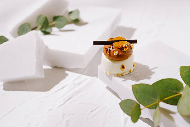 istock Elegant dessert displayed on minimalist white backdrop with greenery accents 2224235376