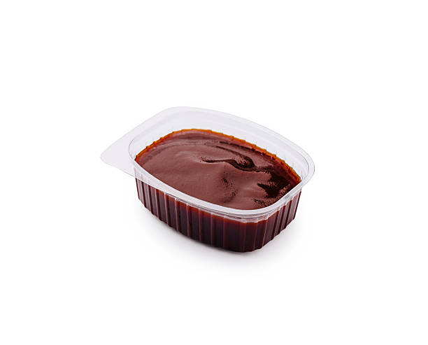 istock Savory barbecue sauce in clear plastic container on a white background 2224236171