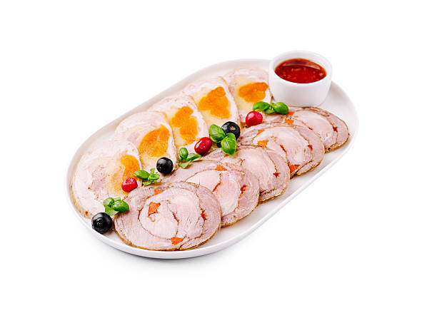 Gourmet meat platter with garnishes for a refined dining experience