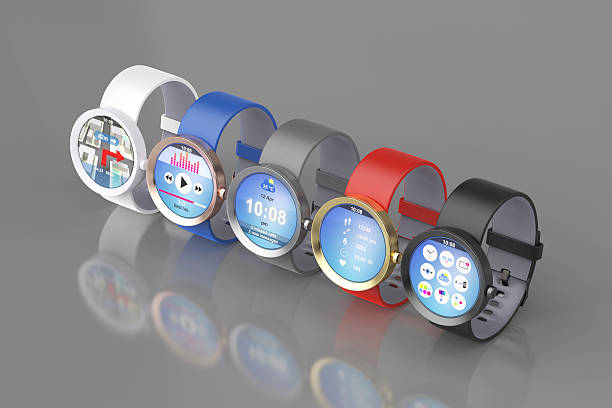 Group of colorful smartwatches on shiny gray background