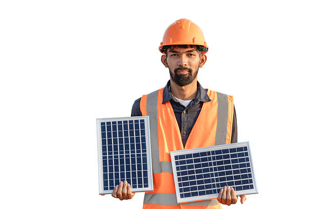 istock Smiling handsome bearded young engineer in hard hat holding solar panels isolated on white background with clipping path. Clean renewable energy concept for the future 2224240449