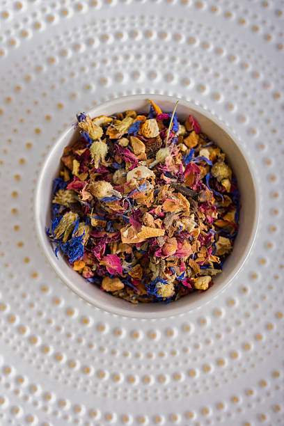 istock Herbal tea. Various dried herbs and fruits in a white plate on a light background. Tea ceremony. Healthy herbal drink. 2224247785