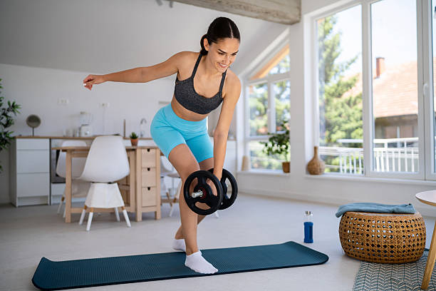 istock Young woman working out at home 2224247822