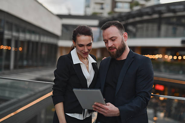istock Team Members Smiling While Watching Company’s Social Media Video Content Together On Tablet 2224249834